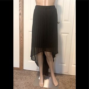 Ladies black pleated high-low skirt, mini slip underneath. Size XL